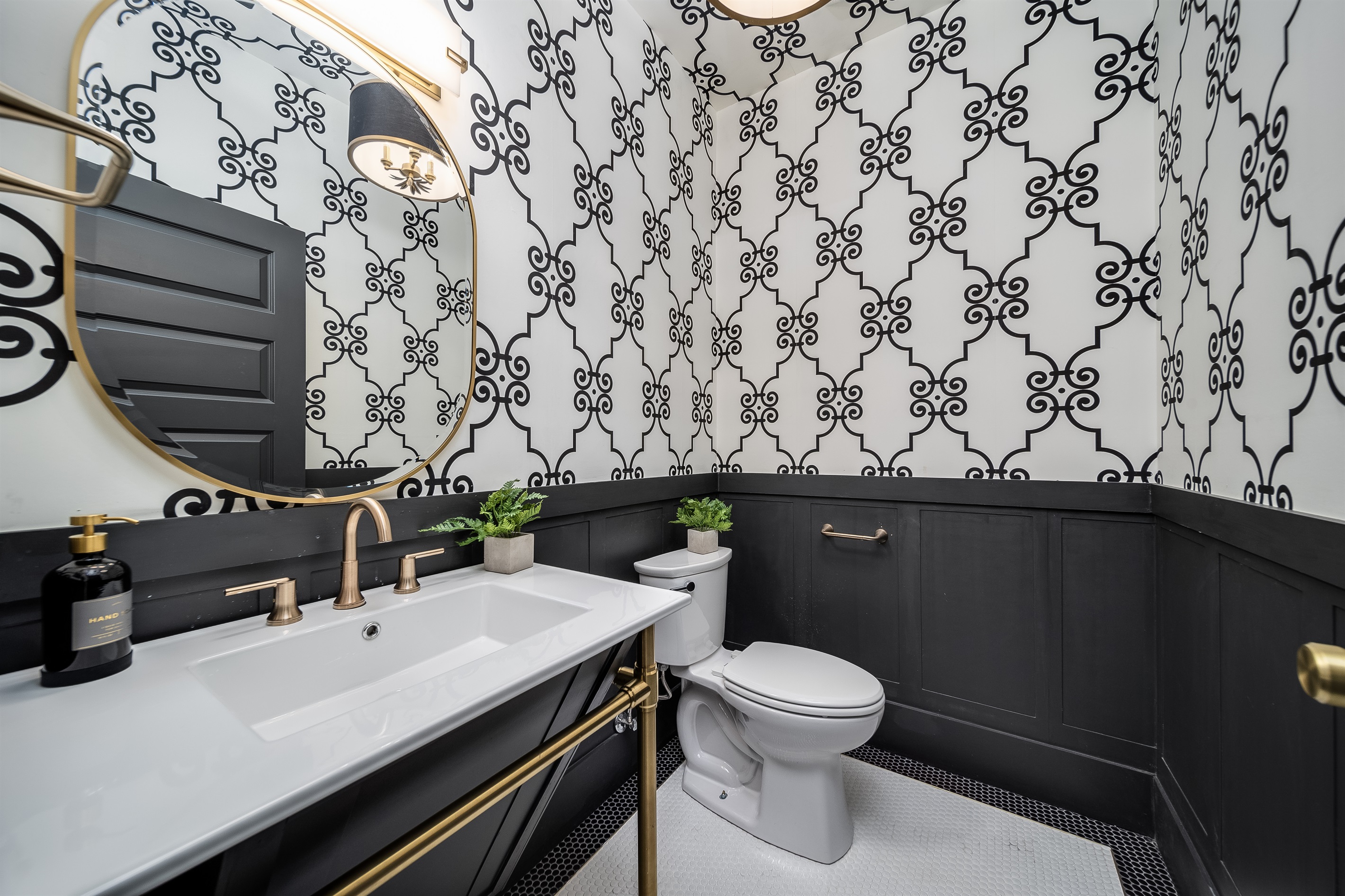 Enjoy the added ease of a well-appointed half-bathroom, thoughtfully placed for quick access