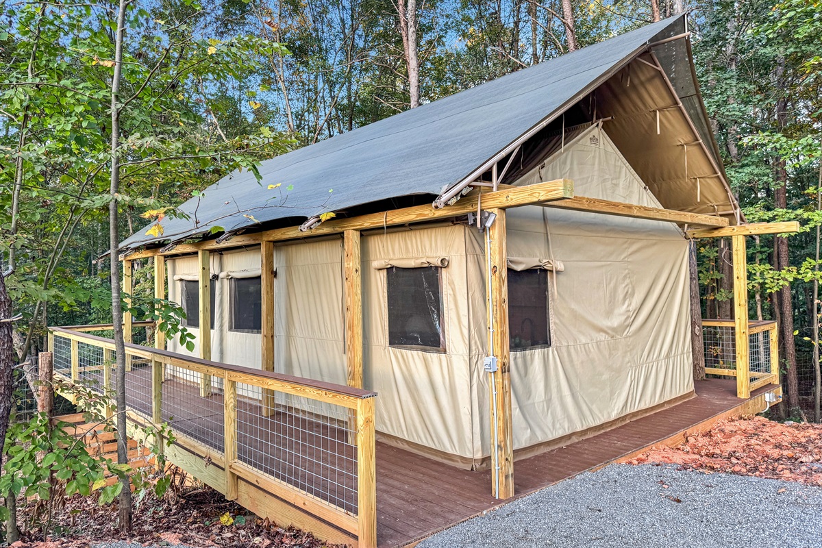 Canvas Glamping Tent: Embrace nature in style with panoramic views and a spacious deck!