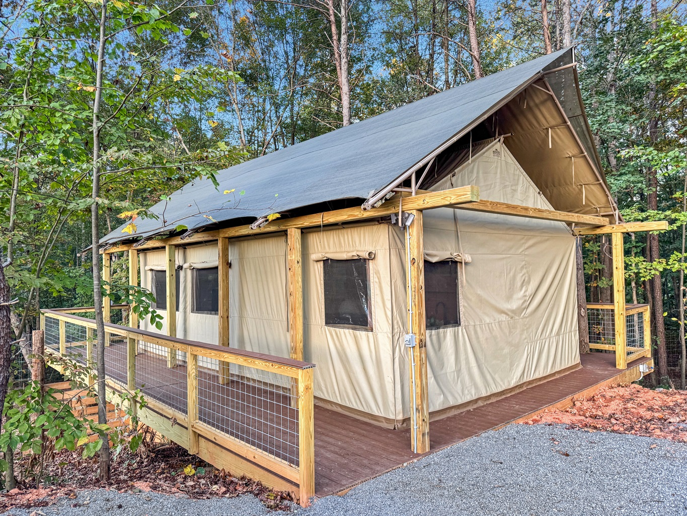 Canvas Glamping Tent: Embrace nature in style with panoramic views and a spacious deck!