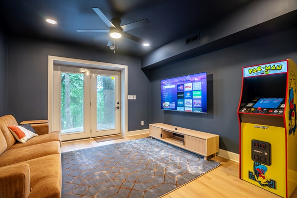 Lower level game room and movie room with direct access to backyard and hot tub. 