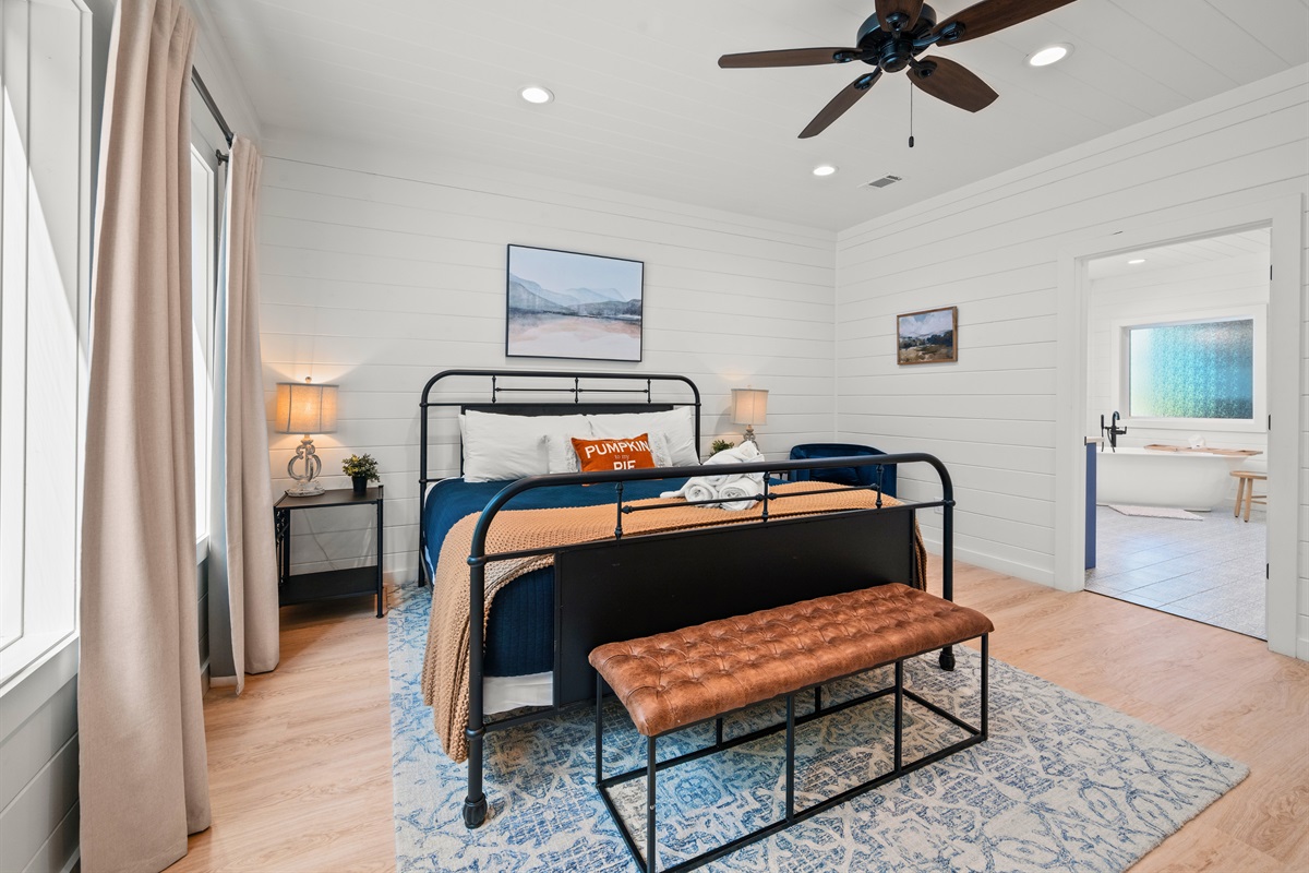 Bright and airy primary bedroom with modern style.