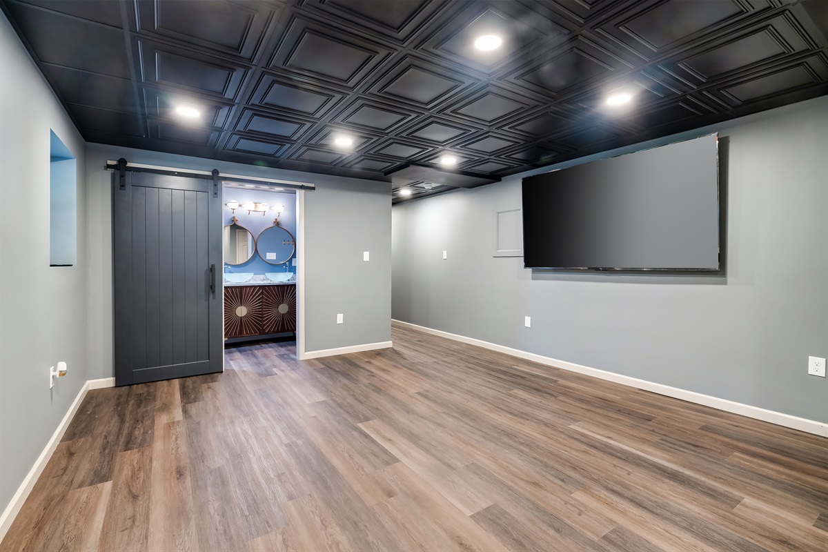 Movie night just got an upgrade! Plenty of space for activities and a massive Smart TV for all your streaming fun in the game room.