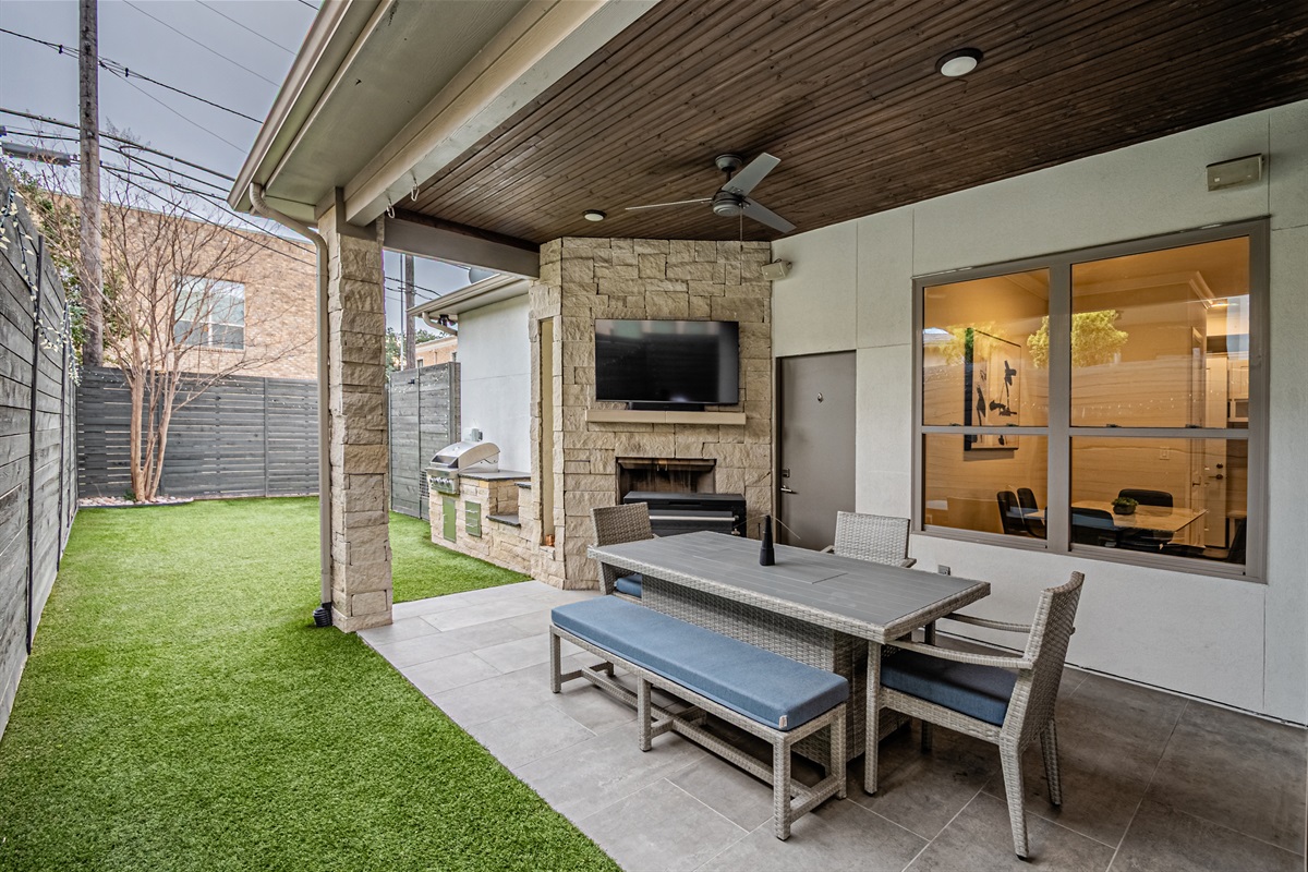 Outdoor living area with TV and seating for relaxing evenings