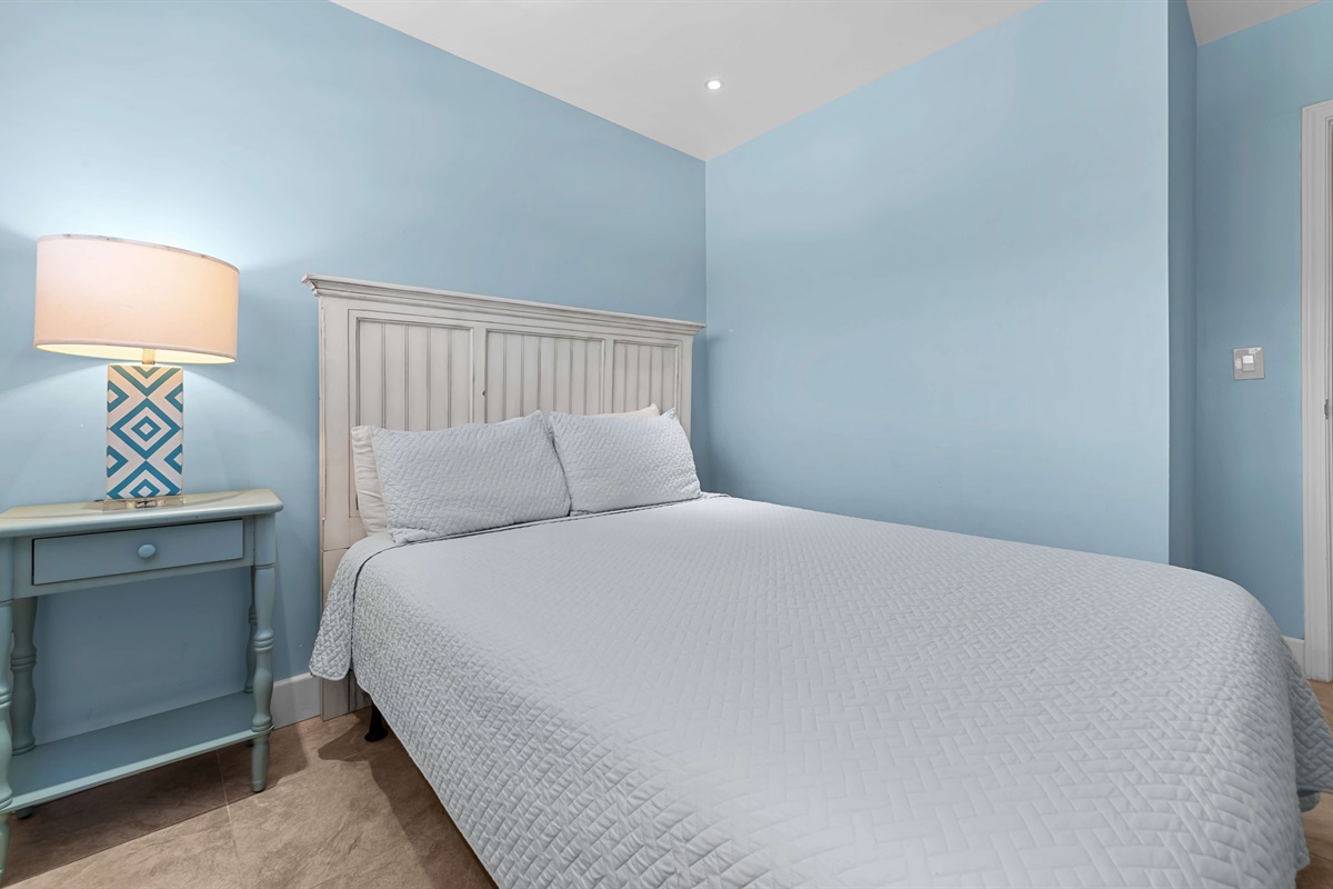 The guest bedroom with queen bed is located upstairs and across from the primary bedroom