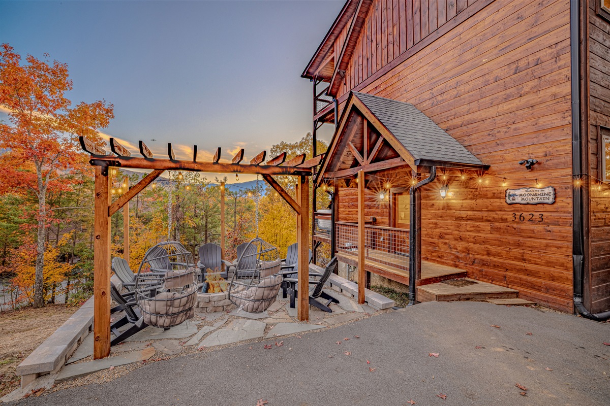 Welcoming front entrance with stunning woodwork and outdoor seating.