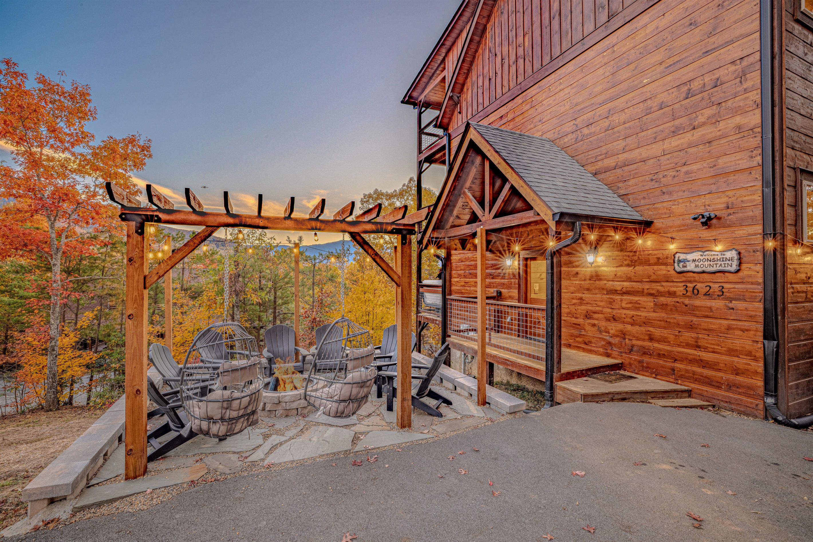 Welcoming front entrance with stunning woodwork and outdoor seating.
