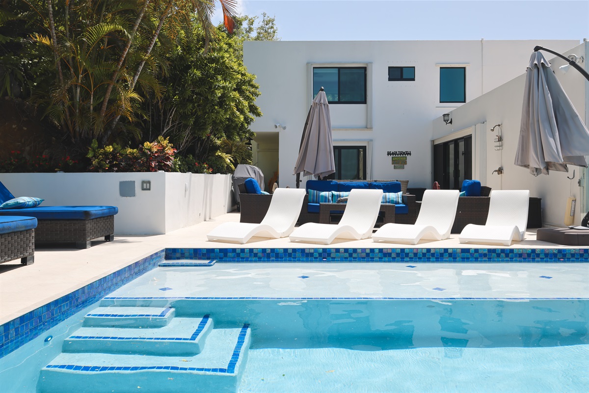 Evoking memories of a swanky resort, Azure Vista Estate's pool deck will be your favorite place to gather and relax.