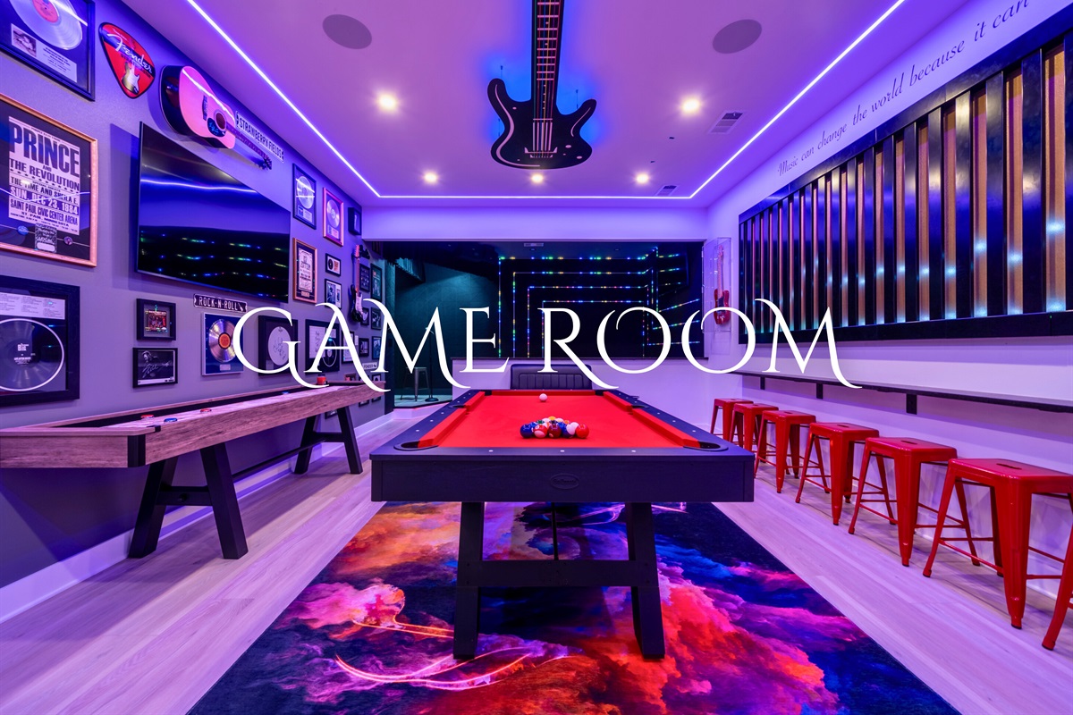 The game room offers endless fun with a pool table and shuffleboard, perfect for competitive play and entertainment.