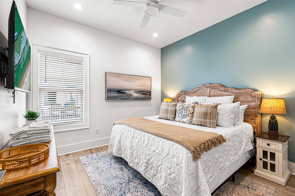 Primary King Bedroom on main level with en-suite bath, and smart TV. Smart TVs are in every bedroom also.