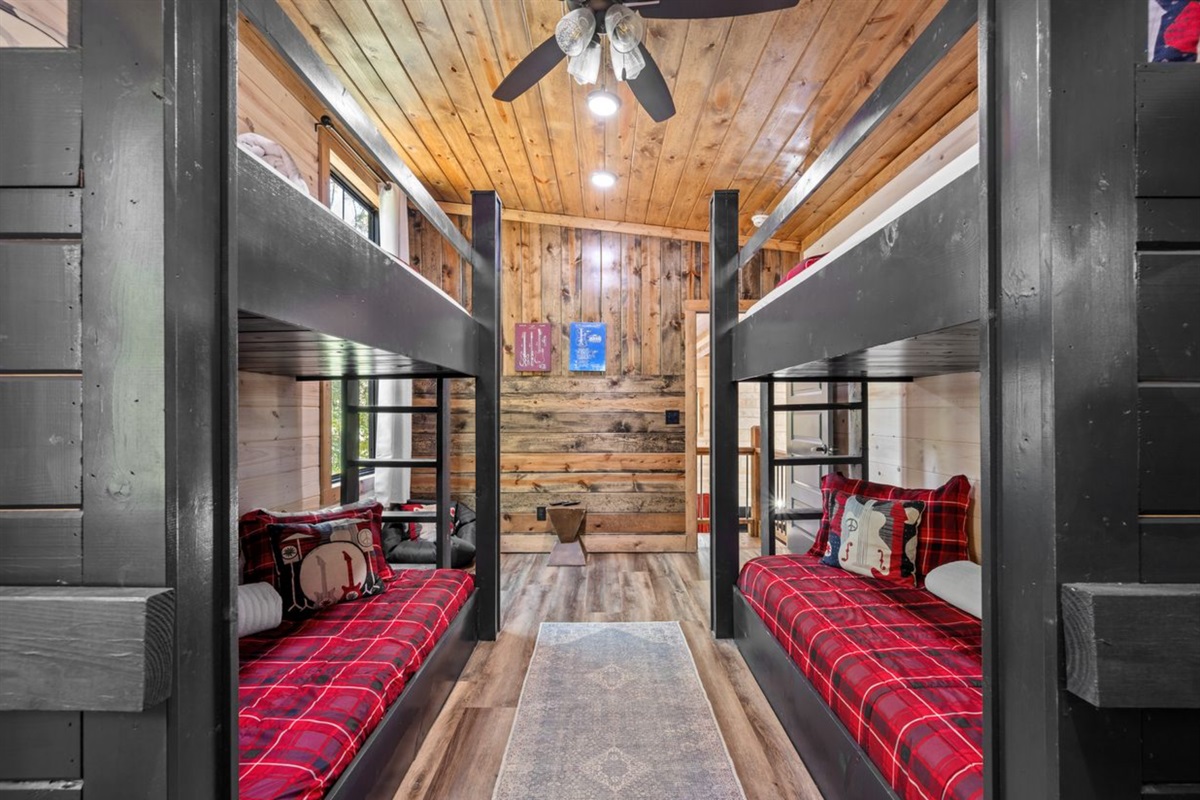 Spacious bunk room with TVs and plenty of room for fun.