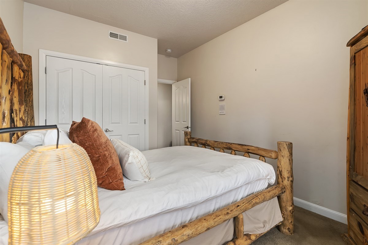 A welcoming bedroom with cozy furnishings and a relaxing atmosphere, perfect for unwinding after a full day.