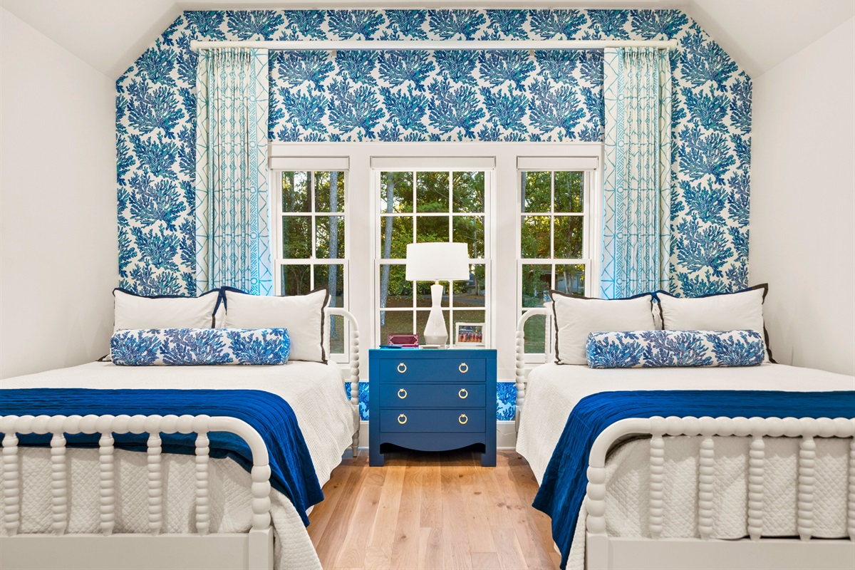Playful room with patterned wallpaper and classic charm.