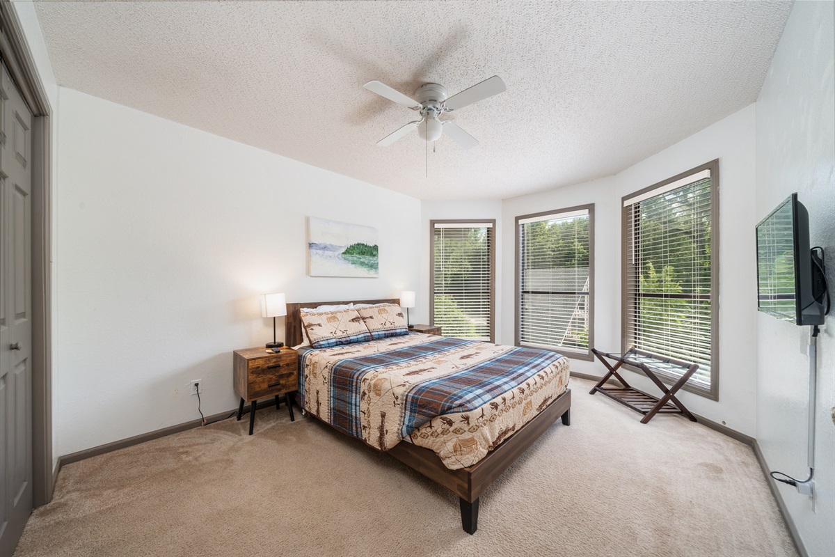 Nice natural light and views of the side yard and lake