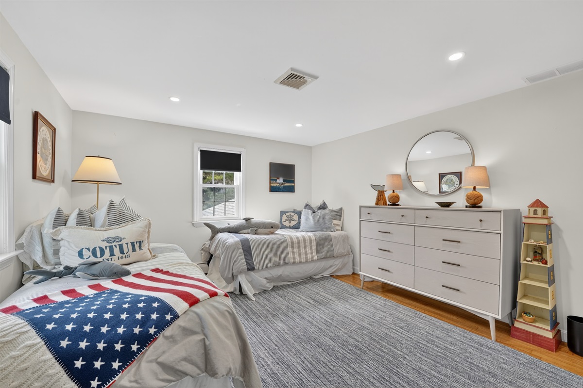 A spacious fourth bedroom with two double beds!