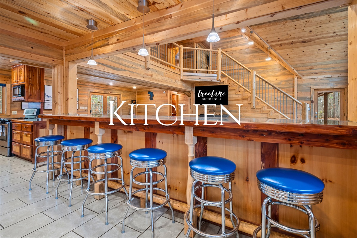 Lined with bar seating, the counter becomes a natural gathering spot for coffee, snacks, and conversation.