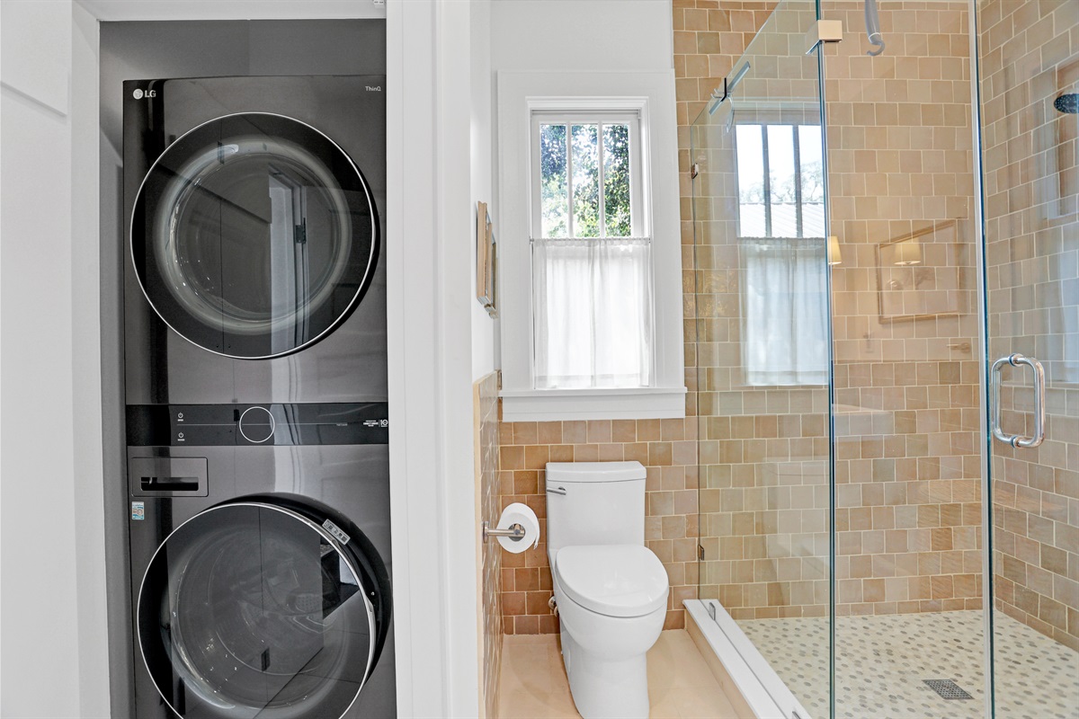 The discreet washer and dryer tucked in the bathroom make laundry easy during your extended stay.