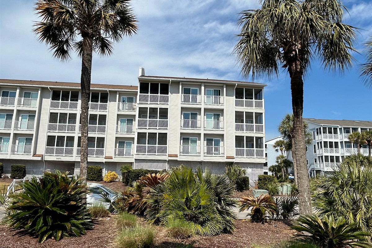 View of Condo when walking back from the Beach. Condo is 3rd Floor Middle left.