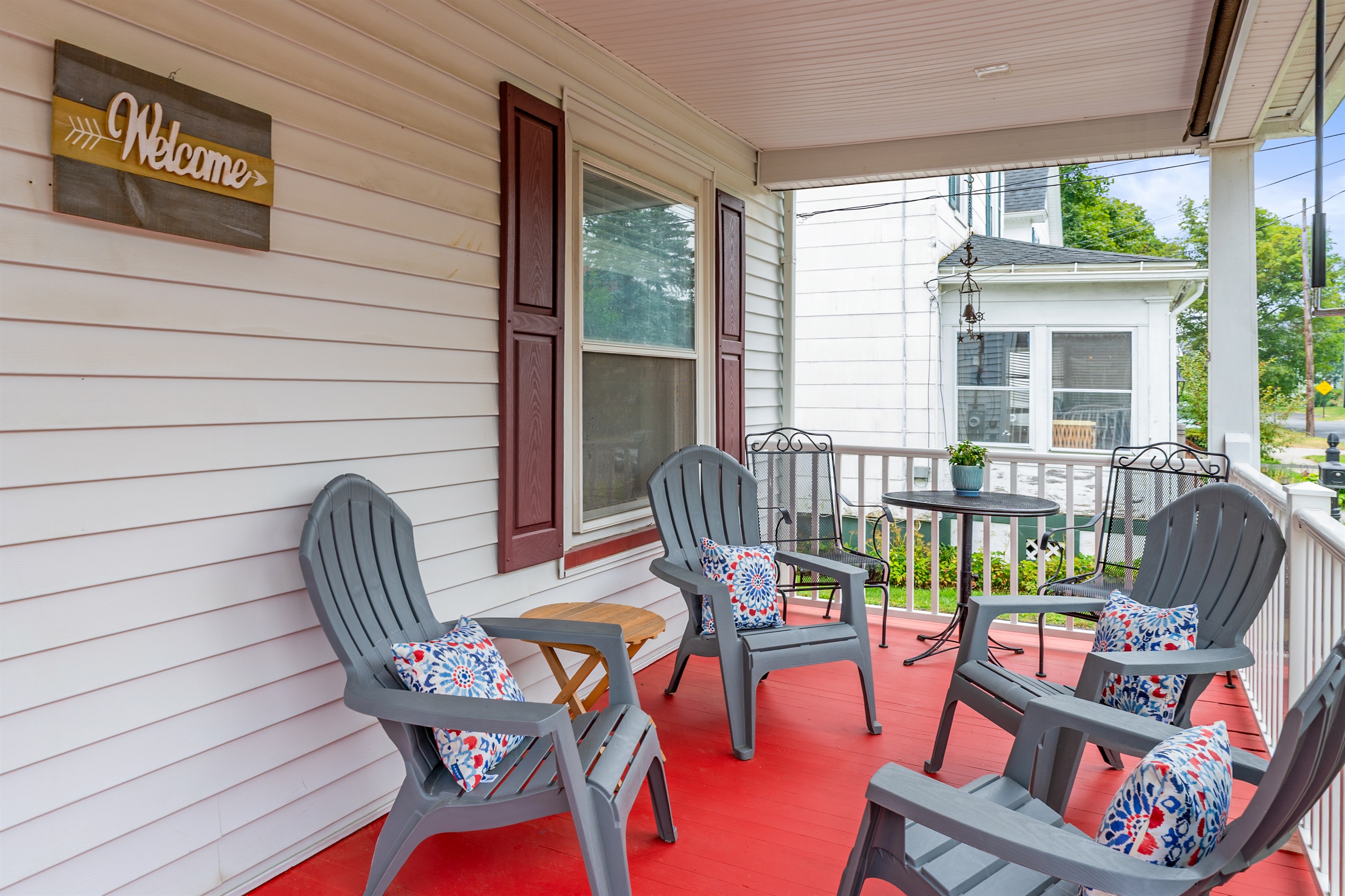 Unwind in style—this covered porch offers the perfect spot for coffee or conversation with friends.