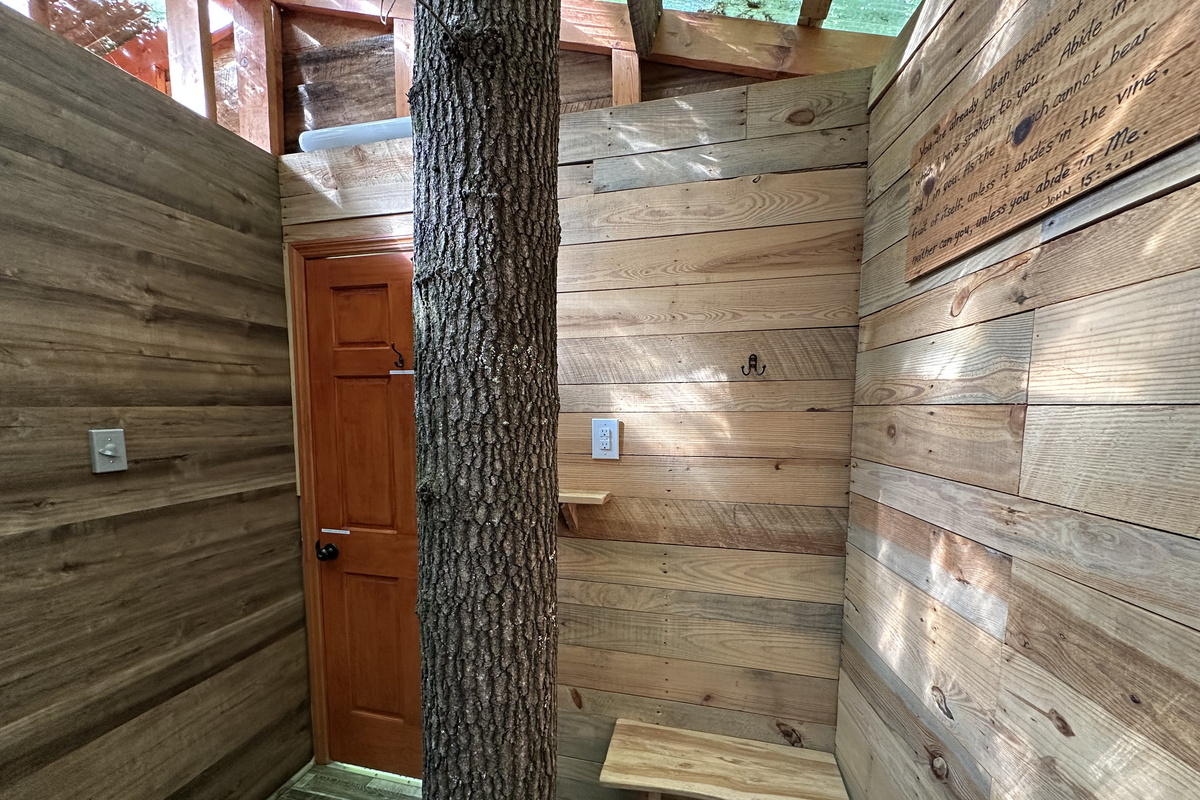 Shower next to a live tree