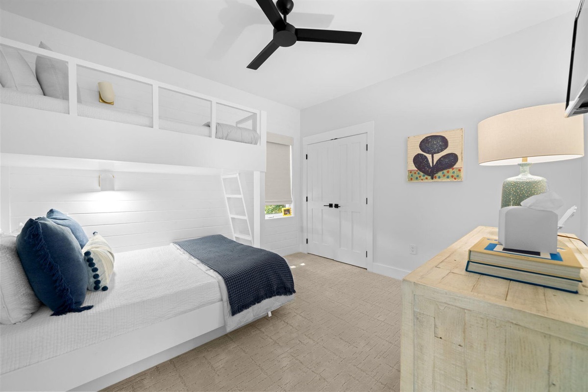 Bunk room offers a dresser and closet.