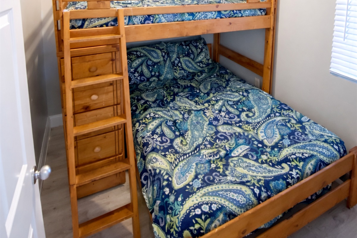 Bunkroom has a double bed with a twin bunk above it and is only a few steps from the second bath. There is a wall-mounted flat screen TV in here as well!
