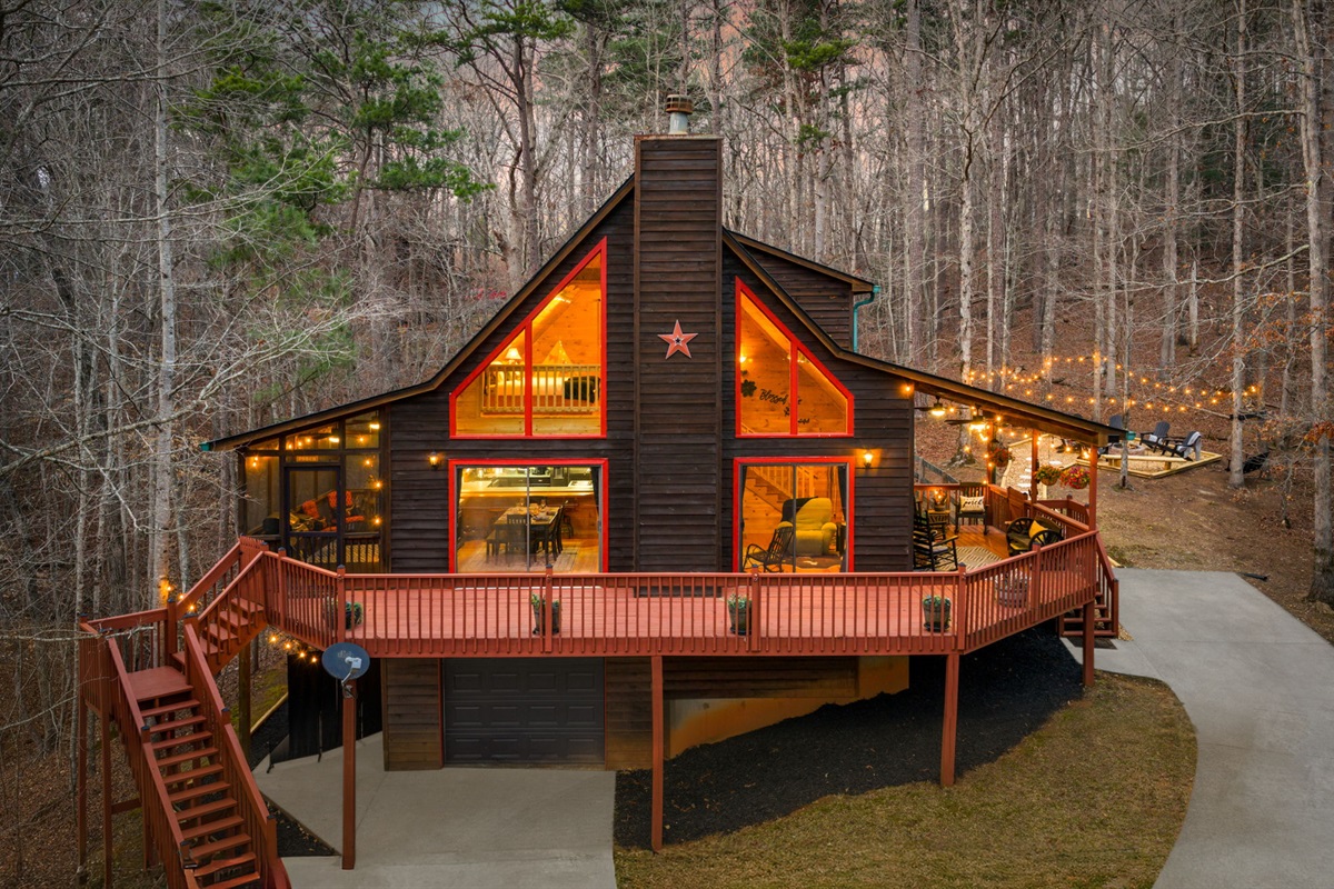 Surrounded by the natural landscape, the glowing home stands out beautifully against the darker surroundings.