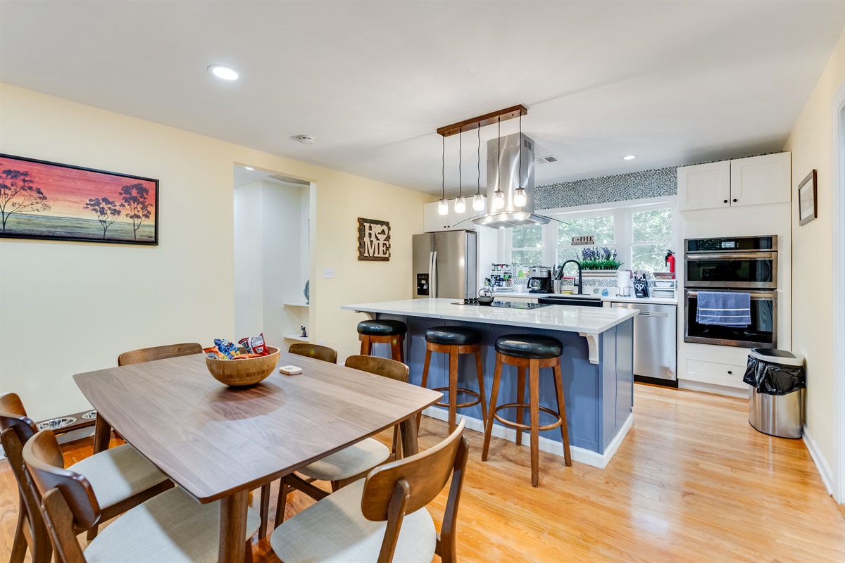 Kitchen: Stylish island bar with modern appliances and natural light—perfect for gourmet meals!
