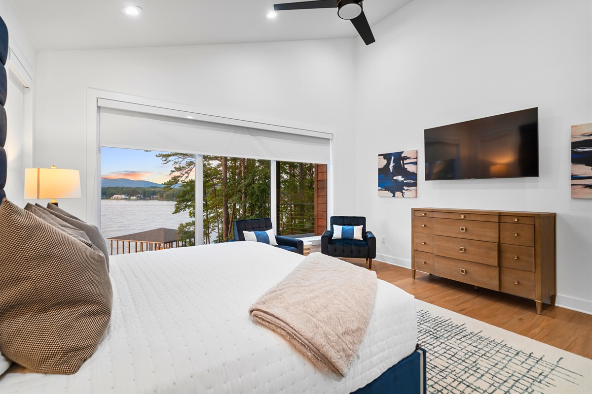 A stylish retreat where comfort meets sweeping lakefront scenery right from bed.