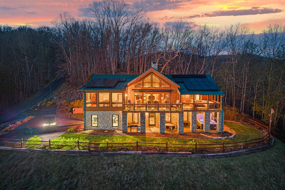 Exterior: Stunning mountain views with vibrant sunsets and spacious outdoor living areas!