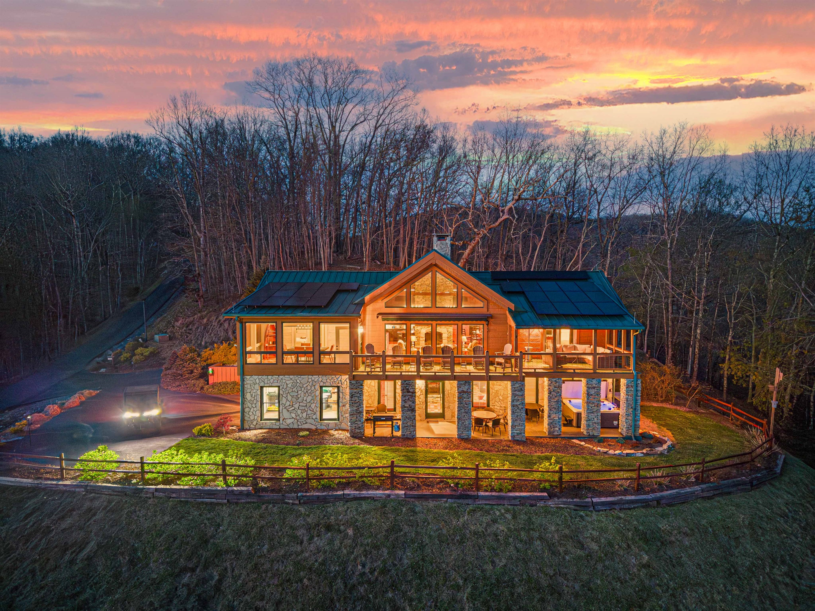 Exterior: Stunning mountain views with vibrant sunsets and spacious outdoor living areas!
