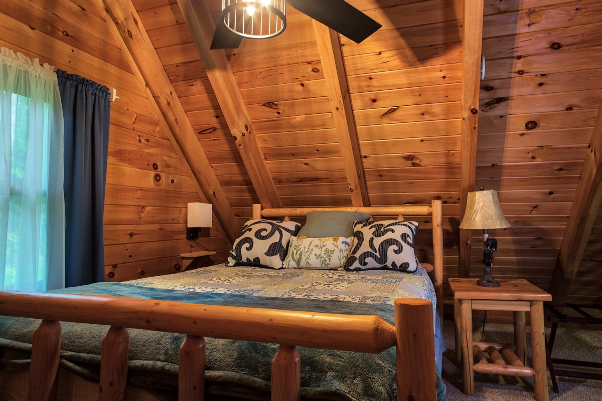 Ascend to the loft bedroom where a queen-size bed awaits, promising nights of sweet, cozy dreams.