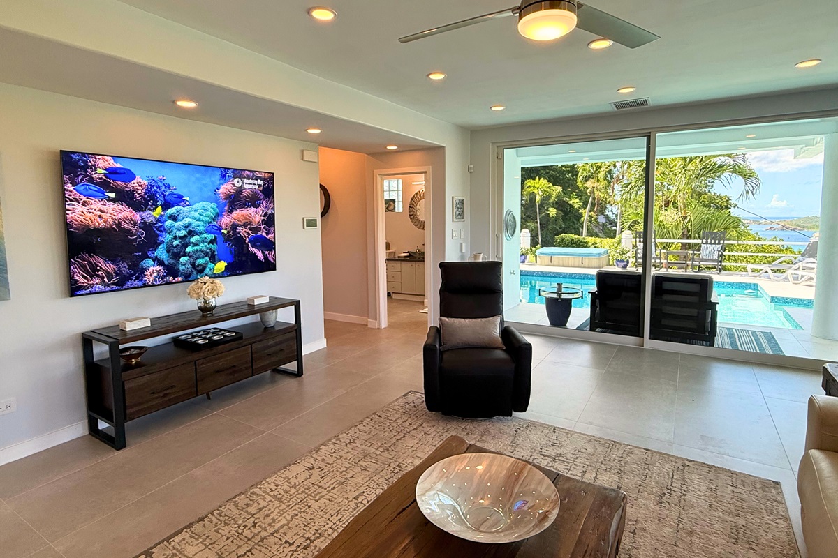 Bonus living room with Smart TV and sliding doors to the pool deck