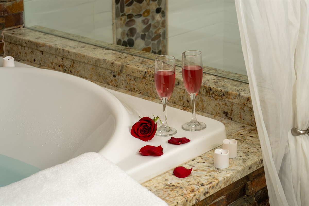 The bathroom is complete with his and hers sinks and a large vanity, providing ample space and privacy—making it a true ensuite sanctuary.