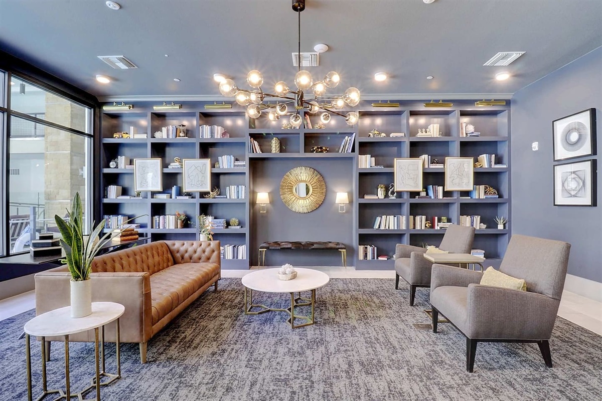 - Stylish library lounge featuring bookshelves, cozy seating, and warm tones   - Great for reading, casual chats, or working in a peaceful setting   - Elegant lighting and decor add sophistication to your stay experience