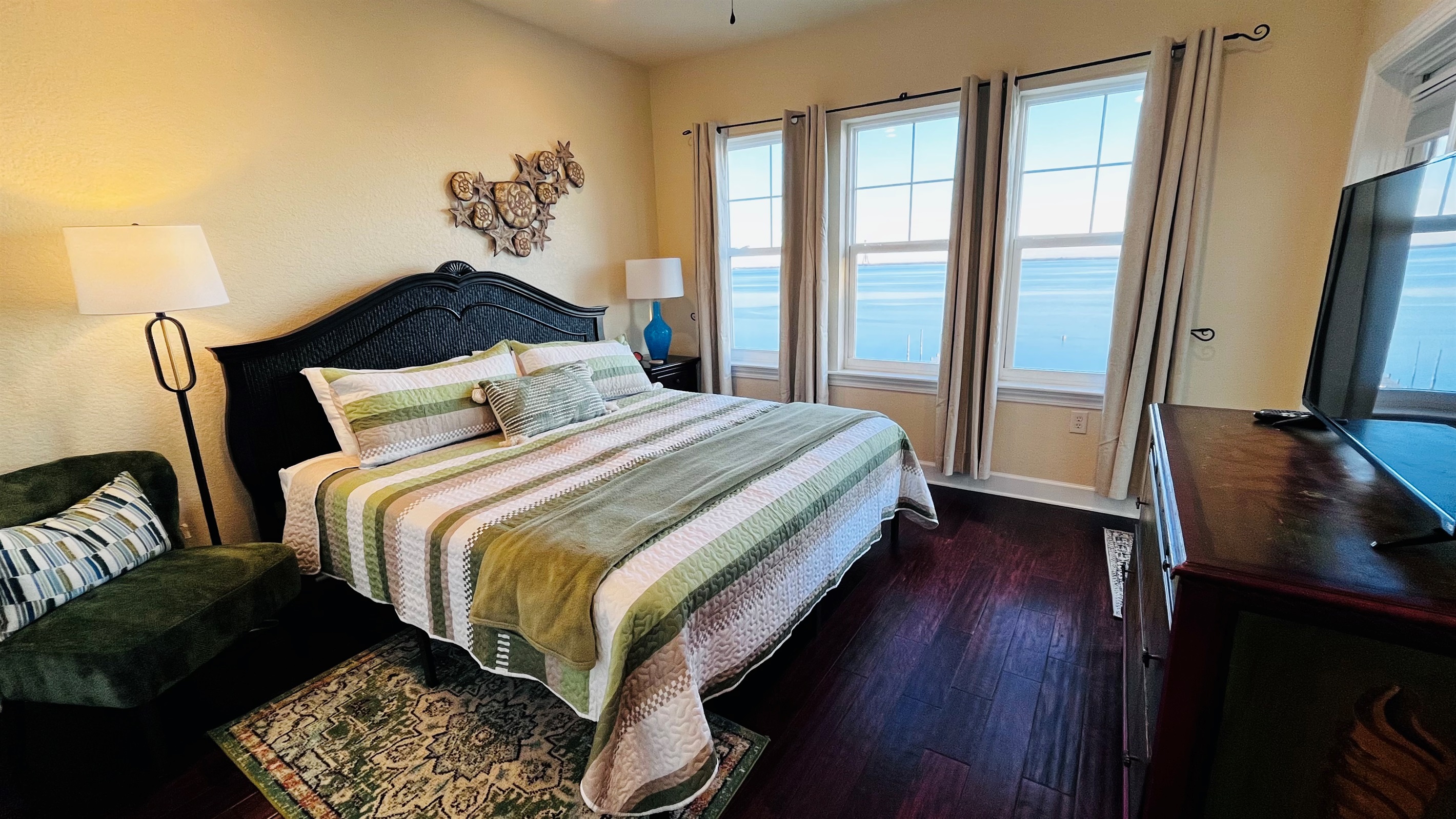 The comfortable king room has gorgeous views of The Sound with balcony access.