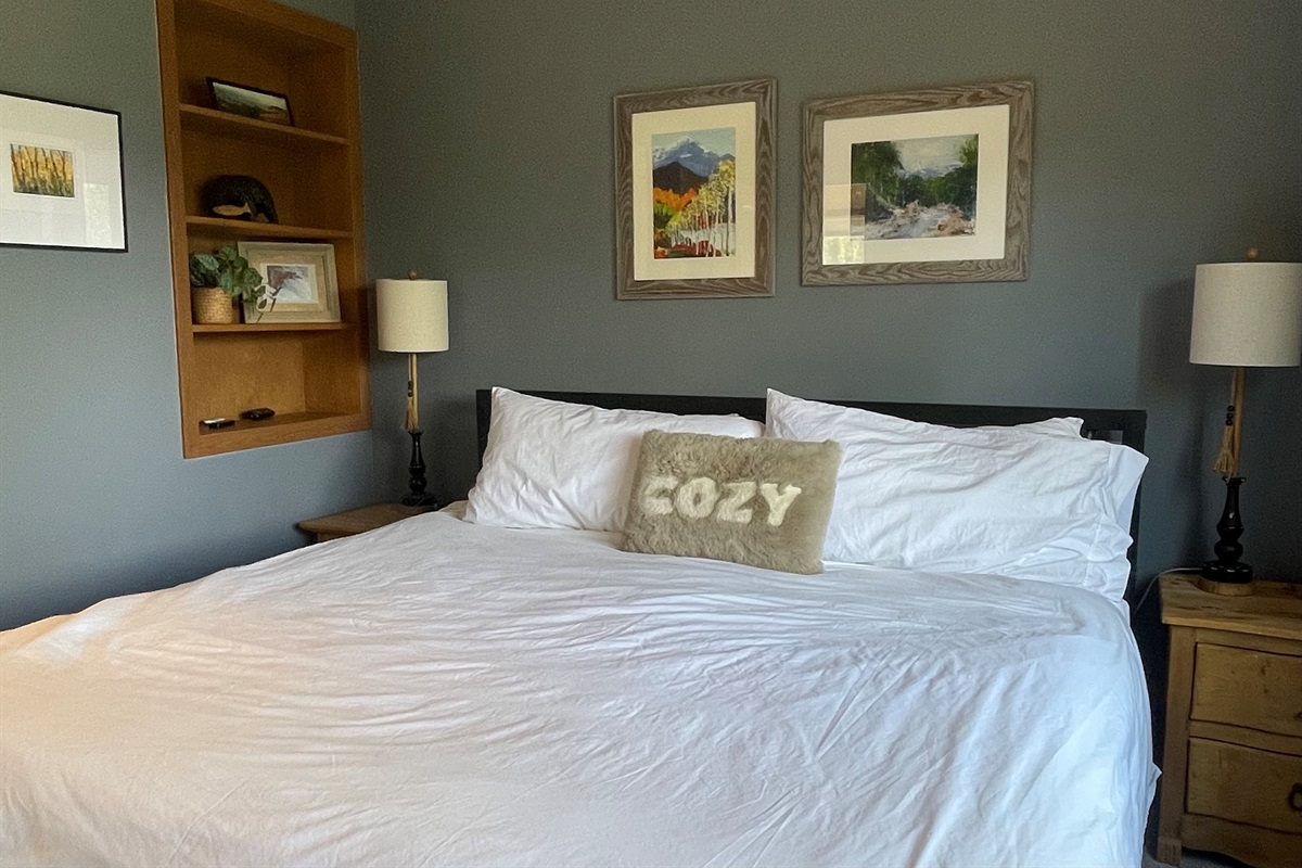 Imagine cuddling up on this large and cozy king bed in the primary bedroom!