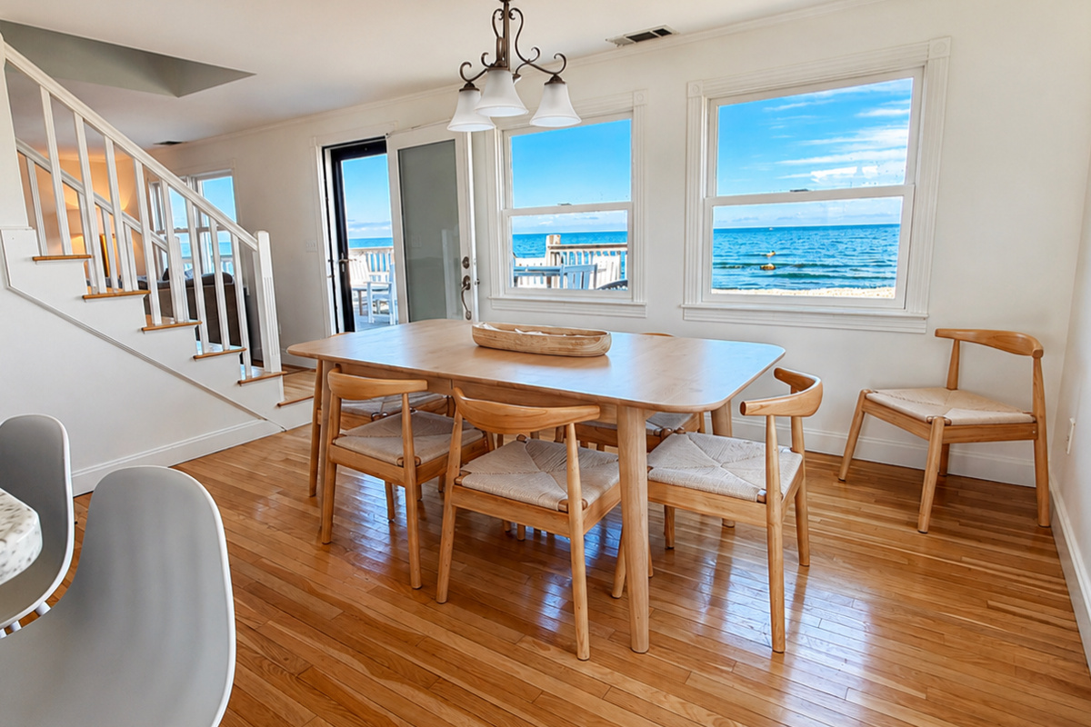 Gather around the dining table while enjoying beautiful ocean views just beyond the windows.