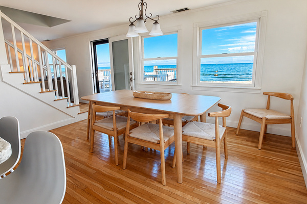 Gather around the dining table while enjoying beautiful ocean views just beyond the windows.