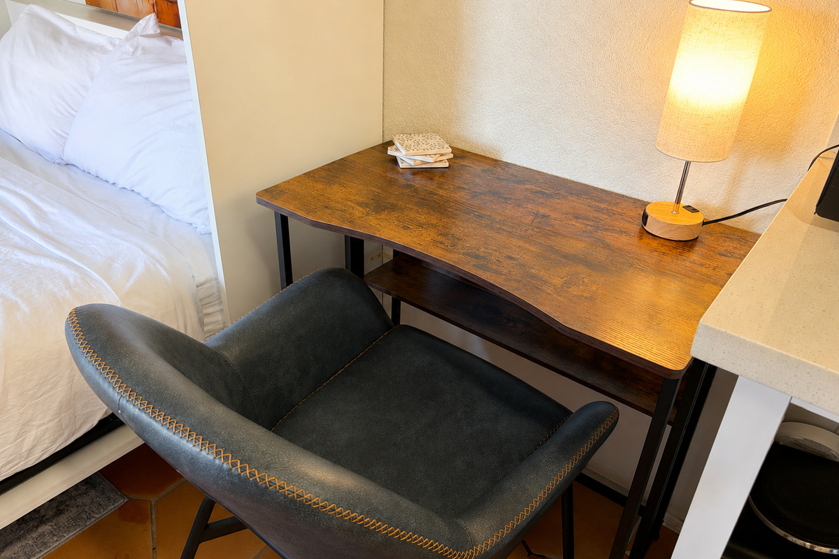 Get some focused work done at this laptop friendly workstation complete with a touch activated lamp that has an outlet for charging devices at night or powering your laptop during the day.