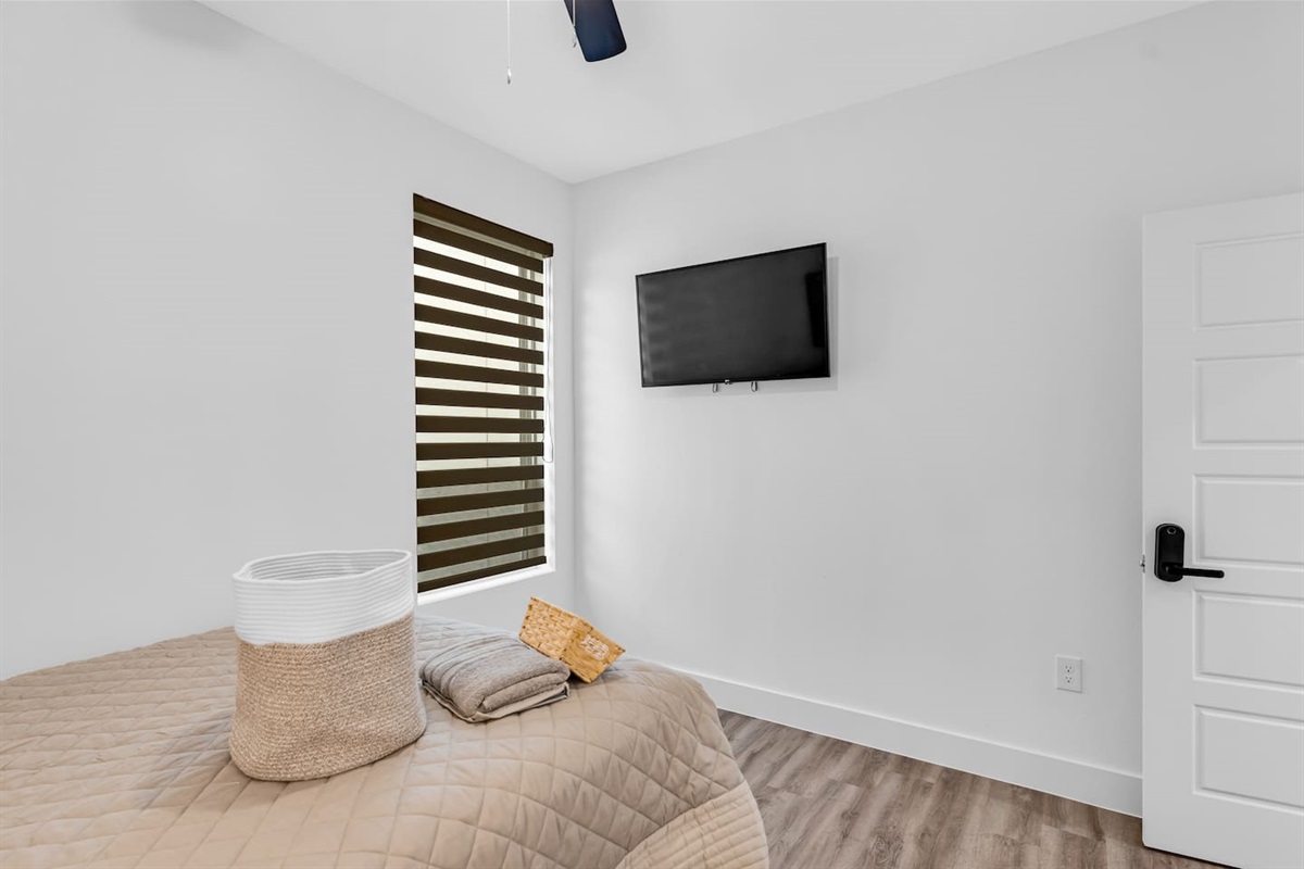 Comfortable and stylish guest room with a TV designed for restful stays.