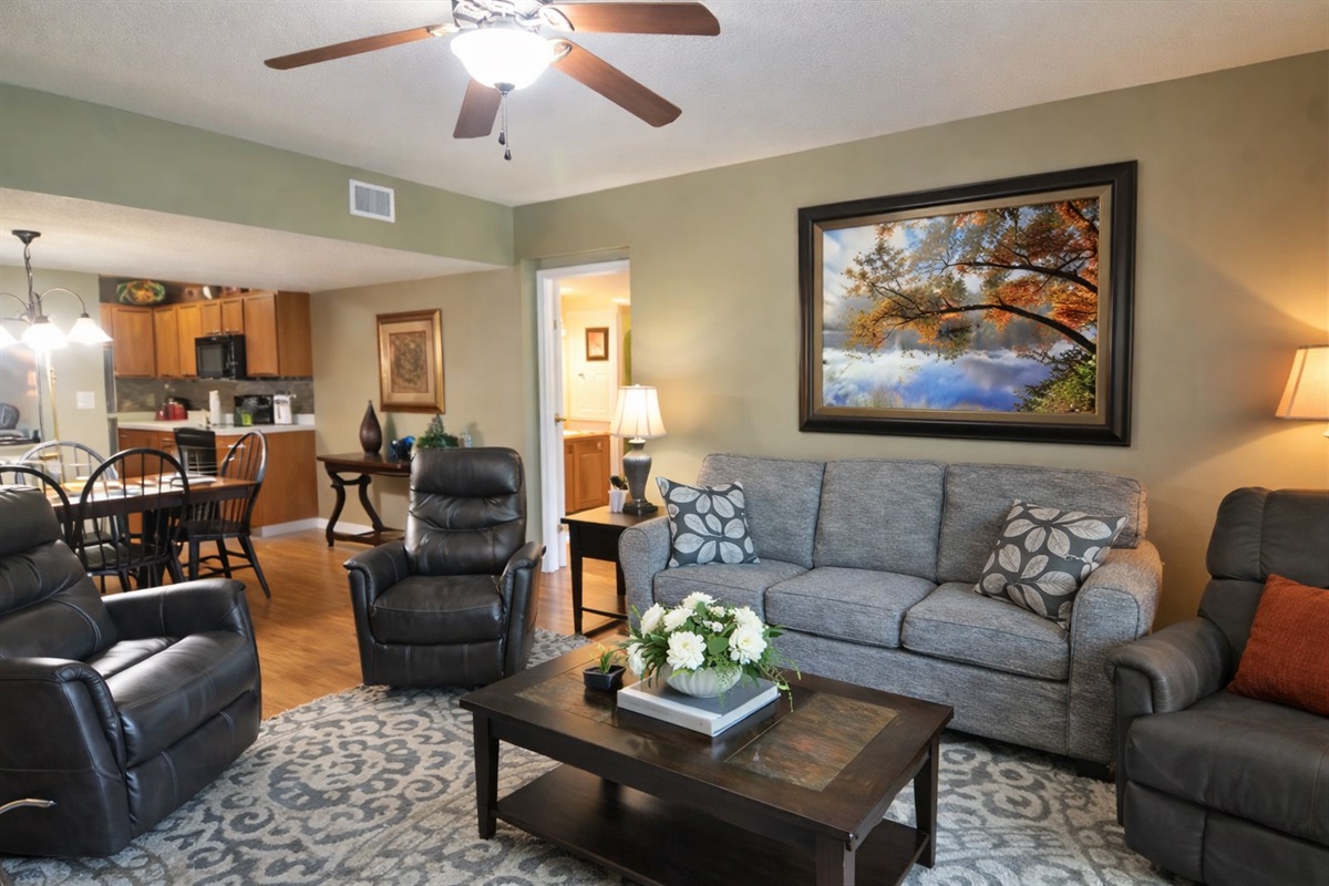 Open-concept living space with comfortable seating, fireplace, and direct access to your private balcony.