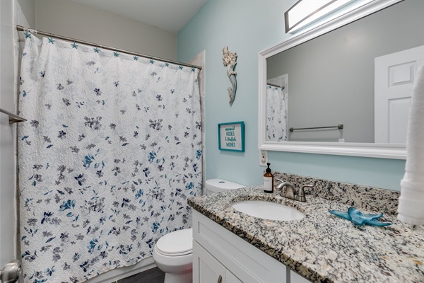 No need to navigate bedrooms. This full bathroom serves the main floor for comfort and convenience.