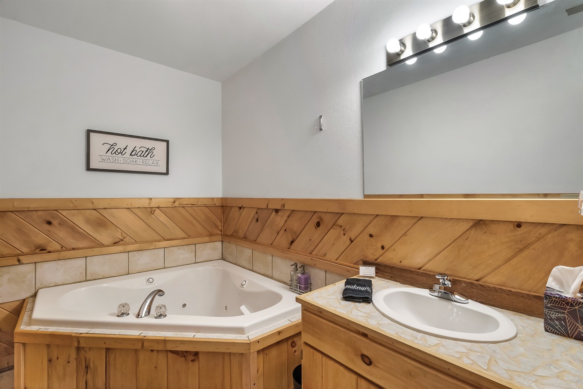 Lower level bath with soaking tub.