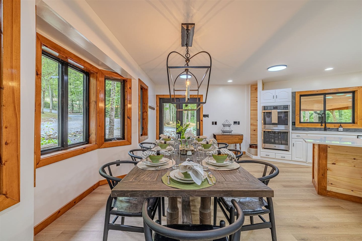 Designed for connection, the dining space comfortably seats eight and flows effortlessly into the gourmet kitchen with double ovens and an expansive island for effortless entertaining.
