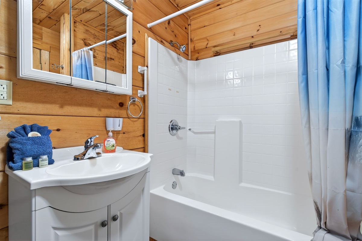 First floor bathroom with combination shower and bathtub 