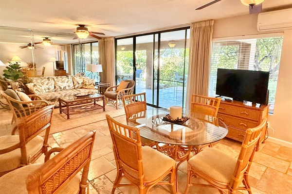 The open concept seamlessly connects the dining and living areas, creating a bright, airy space perfect for gathering.