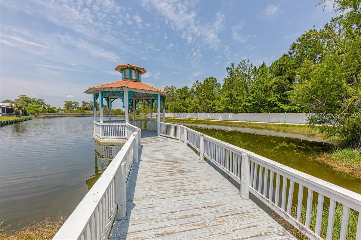 Outdoor Oasis: Stroll along the serene pier to our charming gazebo by the tranquil waters!