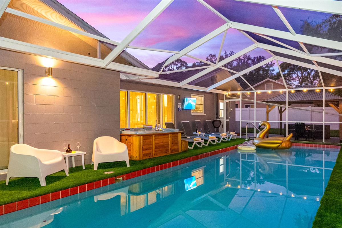 With glowing string lights, a swan floatie, and night-swim vibes, this screened-in pool is made for memory-making.