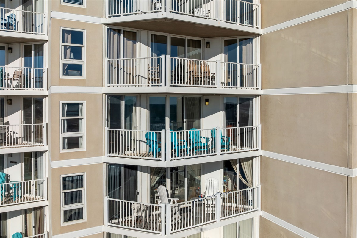 Mid-level building 1 view showing multiple private balconies and resort-style architecture