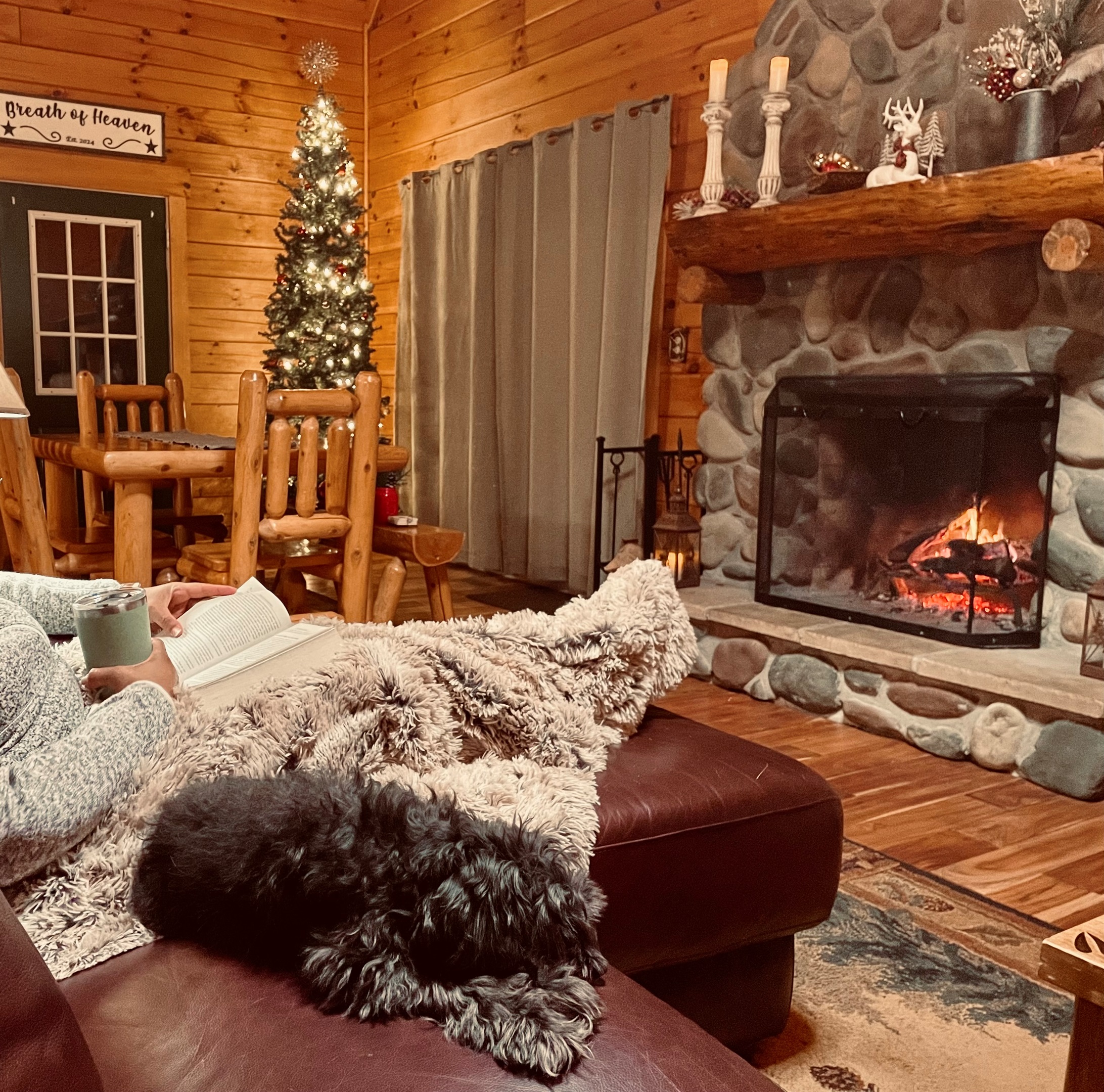 That has got to be the comfiest couch EVER, and a wood burning stone fireplace is A MUST for a Cozy Night in Hocking Hill!
